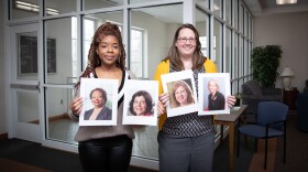 Earlham College Senior Jerilyn Gillenwater and Associate Professor Rachael Reavis hold images of women profiled on Wikipedia by Earlham students.