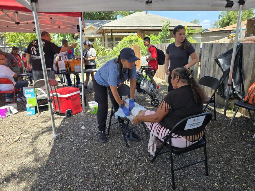Nurse Diana Cavazos treats Alicia with the street nursing team in San Antonio.
