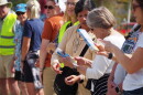 Members of the Kimball Junction library book brigade pass books to one another Oct. 3, 2026.