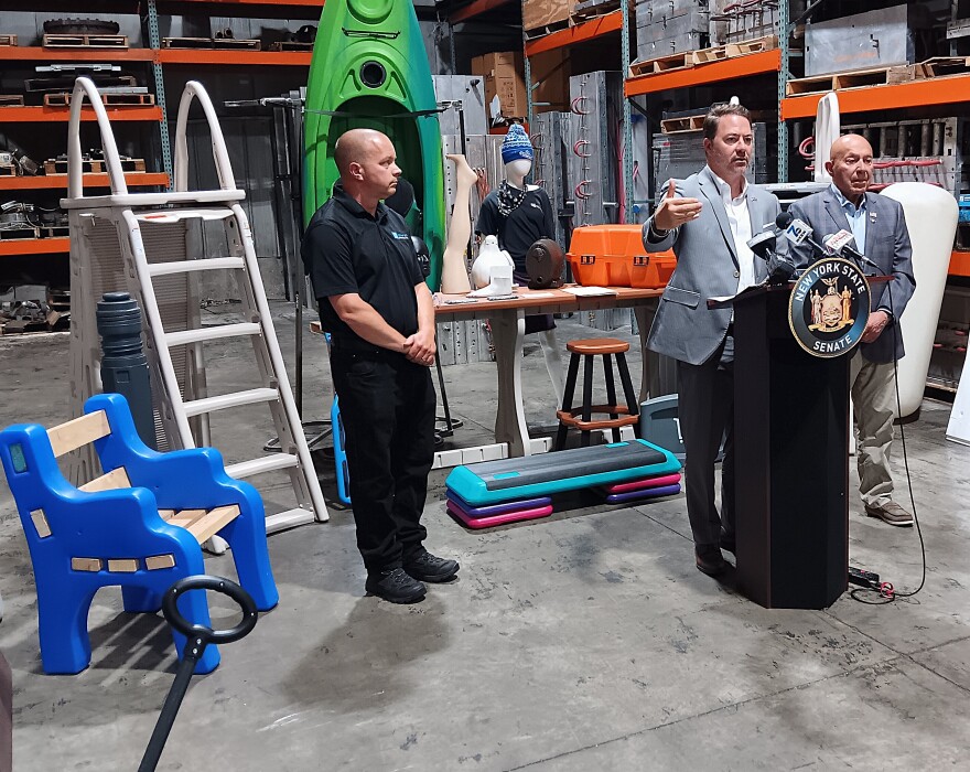State Senator Robert Ortt speaks Wednesday, July 15, 2026 during an appearance at Confer Plastics in North Tonawanda, NY. Listening near him are, from left, Bob Confer, president of Confer Plastics, and State Assemblymember Angelo Morinello.