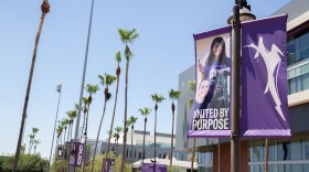 GCU signs on campus with palm trees behind 