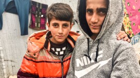 Mazen (right), 13, and his brother Mezban in a camp for displaced Yazidis in the Kurdistan region of Iraq. Mazen was freed recently, five years after being kidnapped by ISIS. He was found in Baghouz, the last ISIS stronghold in Syria. His brother was also kidnapped and, 2-1/2 years ago, was rescued with their mother. The boys' father is still missing.