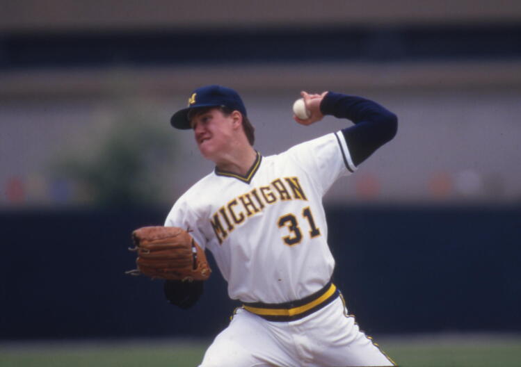 A 1987 file photo shows Jim Abbott pitching for the University of Michigan baseball team.