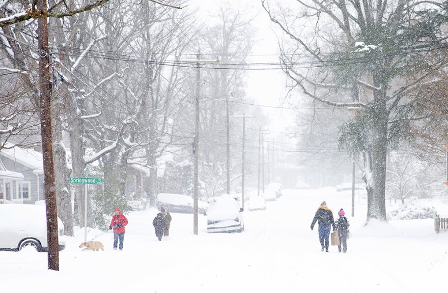 Hardy folks get out in the winter snow storm Sunday, Dec. 9, 2018, in Greensboro, N.C. 