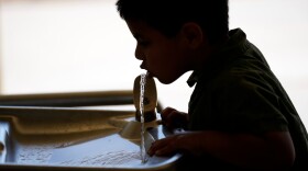 FILE - A student drinks from a water fountain inside Cuyama Elementary School, Sept. 20, 2023, in New Cuyama, Calif. (AP Photo/Marcio Jose Sanchez, file)