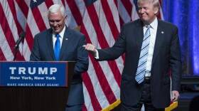 Republican presidential candidate Donald Trump, right, introduces Gov. Mike Pence, R-Ind., during a campaign event to announce Pence as the vice presidential running mate on, Saturday, July 16, 2016.