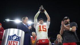 Kansas City Chiefs quarterback Patrick Mahomes (15) holds up the Lamar Hunt Trophy next to Kansas City Chiefs tight end Travis Kelce (87) after the AFC Championship NFL football game against the Baltimore Ravens, Sunday, Jan. 28, 2024, in Baltimore. The Chiefs won 17-10. (AP Photo/Matt Slocum)