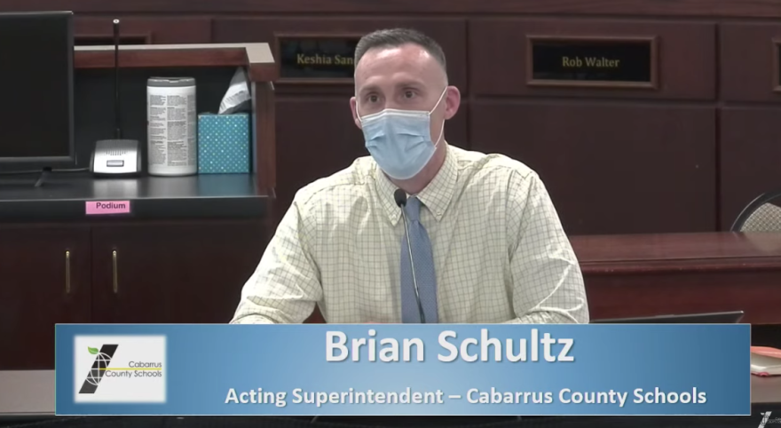 Acting Superintendent Brian Schultz reports on COVID-19 data at Friday's emergency Cabarrus County school board meeting.