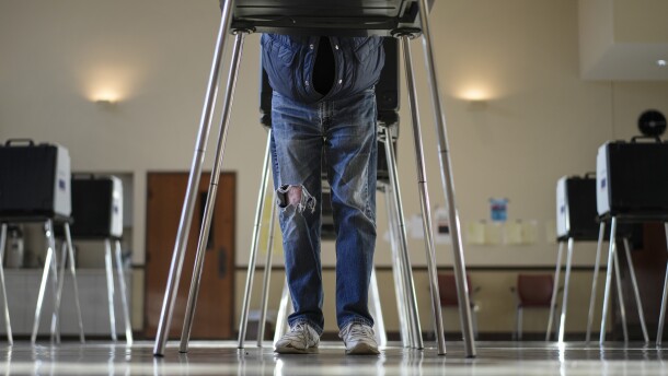 A voter fills out their Ohio primary election ballot at a polling location.