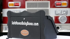 FILE - This Feb. 26, 2015 file photo shows a prototype of a baby box, where parents could surrender their newborns anonymously, outside the fire station in Woodburn, Ind. An Indiana proposal to allow fire stations and other public places to install "baby boxes" so mothers in crisis could anonymously surrender their newborns needs further review and is unlikely to advance this year, a key lawmaker said Tuesday, May 24, 2015. Sen. Patricia Miller, whose Senate health committee is scheduled to hear the bill Wednesday, May 25, said she expects the bill to be amended to send it to study committees for further evaluation. (AP Photo/Michael Conroy, File)