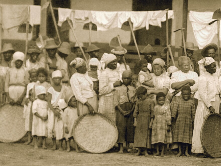 A detail from a photo of slaves going to the coffee harvest with oxcar. Vale do Paraiba, Sao Paulo, 1885.