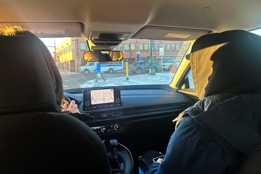FILE- A pair of volunteer observers patrol south Minneapolis neighborhoods Tuesday, Jan 27, 2026, looking for signs of activity by federal immigration officers.