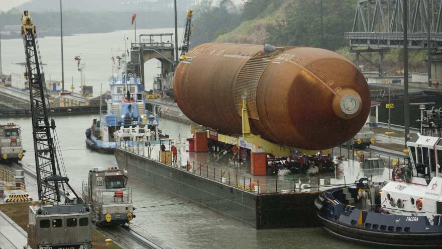A tugboat and barge transporting NASA's only remaining space shuttle external tank makes it through the Miraflores locks in the Panama Canal in April. The tank was headed to the California Science Center in Los Angeles as part of the Space Shuttle Endeavour display.