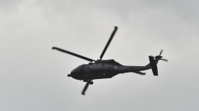 A federal police Black Hawk helicopter flies over a house at the end of a tunnel through which drug lord Joaquin "El Chapo" Guzman could have escaped from Mexico's Altiplano prison.