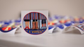 a sticker says "I voted" with feet