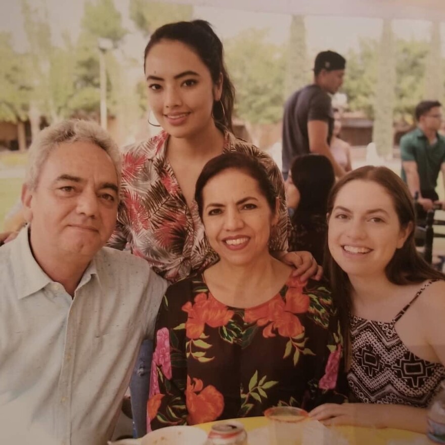 Ana Hernandez (standing) and younger sister Claudia (far right) are among voters on the Texas-Mexico border who have strong ties to both sides. The Hernandez sisters, who live in El Paso, are pictured in a family photo with their parents in Ciudad Juarez.