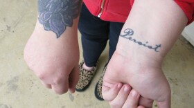 This woman, who has had her prostitution charge wiped away, says she got the lotus tattoo to cover up the brand of a former pimp. "Once they put their name on me, I was their property," she adds. She says she got the word "persist" tattooed as a reminder to keep moving forward.