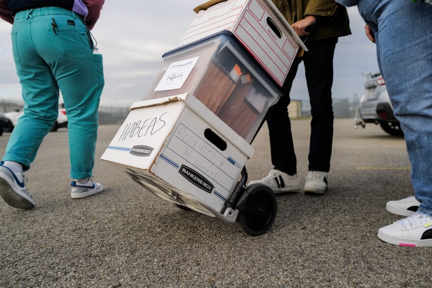 Advocates cart documents into the South Louisiana ICE Processing Center in Basile, Louisiana. 