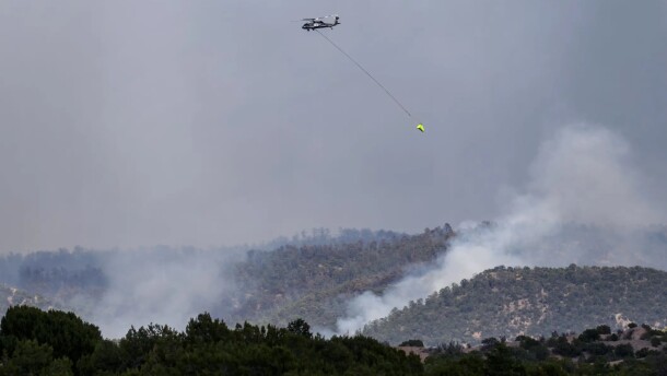 Firefighting aircraft battle the Frijoles Fire in the Pecos Wilderness on Aug. 12. The blaze has now grown to more than 11,000 acres.