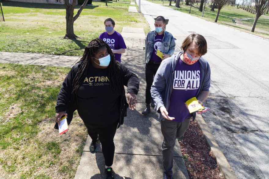 Kayla Reed (front left) joins volunteers from labor unions and NARAL Pro-Choice Missouri to knock on doors in a majority-Black neighborhood to advocate for Tishaura Jones in March.