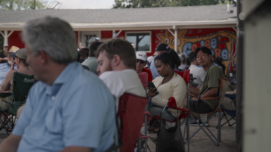 Customers settle into lawn chairs while waiting in line outside Goldee’s Barbecue in Fort Worth.