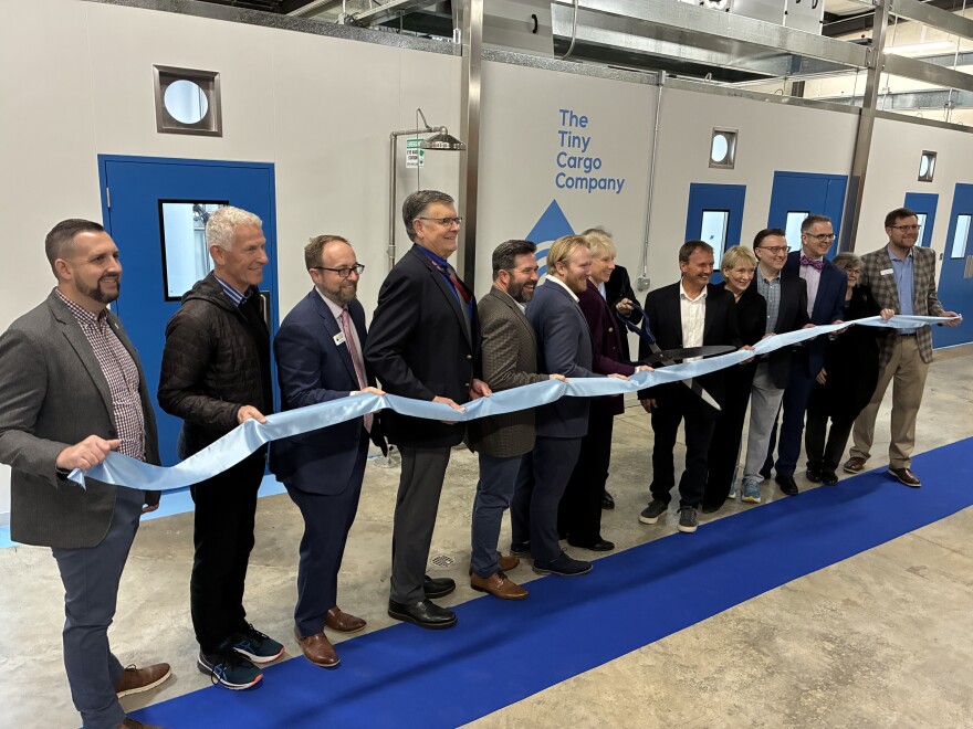 Roanoke and company officials cut the ribbon on the Tiny Cargo Company's new Roanoke plant.