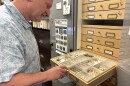 Lyle Buss, a senior biological scientist at the University of Florida, examines preserved tussock moth specimens after their transition in Gainesville, Fla., Thursday, April 2, 2026. Female moths are wingless, while males have wings. (Annaleis Holz/WUFT News)