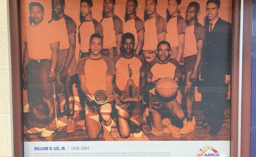 A poster on the side of the new heritage center depicting Bill Lee (top left), founder the African American Resources Cultural and Heritage (AARCH). Circa 1928-2004