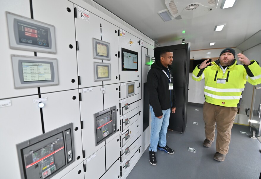 Amazon representatives explain how server racks are monitored inside data centers.