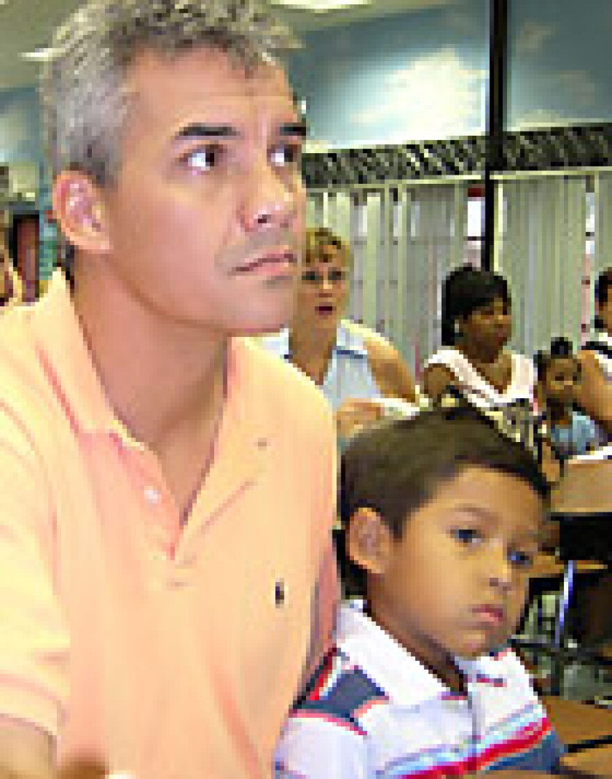 Back in 2004, Paul Marsenison, with young Sam at his side, listened intently during an orientation session for new parents .