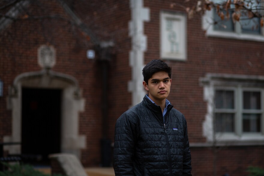  Washington University senior John Harry Wagner stands in front of his old fraternity house, Beta Theta Pi. Wagner quit along with most of the brothers during a reckoning over racism and sexual harassment in Greek life. "In the end," he said, "it can't really be safe."