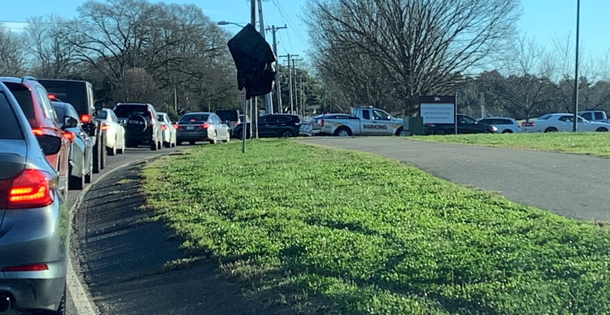 A view from the end of the line at a COVID testing site in Rock Hill Friday morning. This was the line to the waiting area. From here, vehicles queued up along the side of Eden Terrace for a half-mile. Not shown: the lines snaking around the parking lot where the testing tents were.