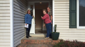 Irmo Resident Karen Elliot cuts a ribbon to welcome neighbors, rebuild volunteers and friends into her repaired home. 