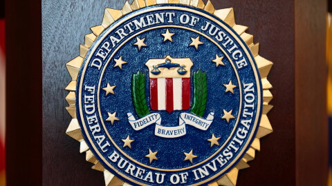 FILE - An FBI seal is displayed on a podium before a news conference at the field office in Portland, Ore., Jan. 16, 2025.