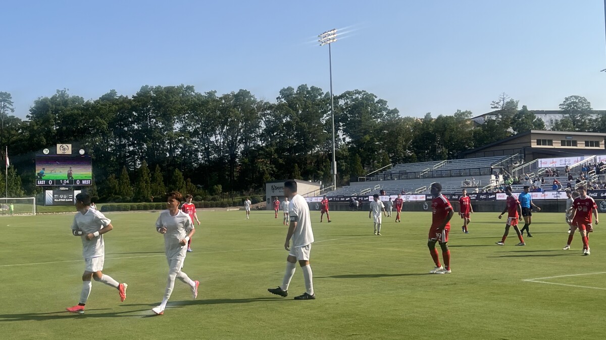 Special Olympics athletes take the field in Matthews ahead of the MLS All-Star Game at Bank of America Stadium
