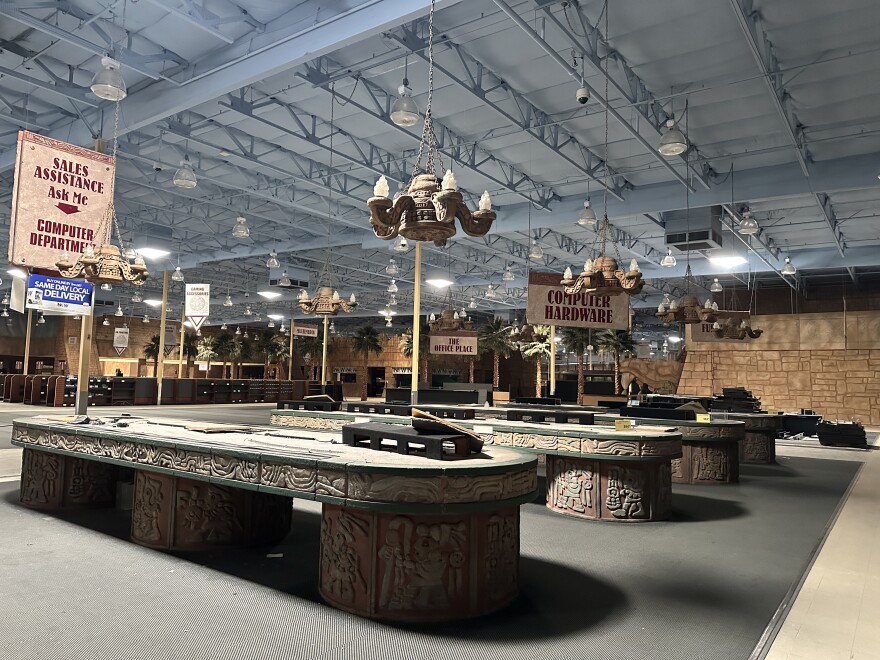 Signs and shelving, fake palm trees, stone chandeliers and a 10-foot-tall snake statue were among the items up for auction at the former Fry's Electronics in Phoenix earlier this week.