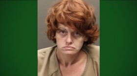 Mug shot of a woman. 