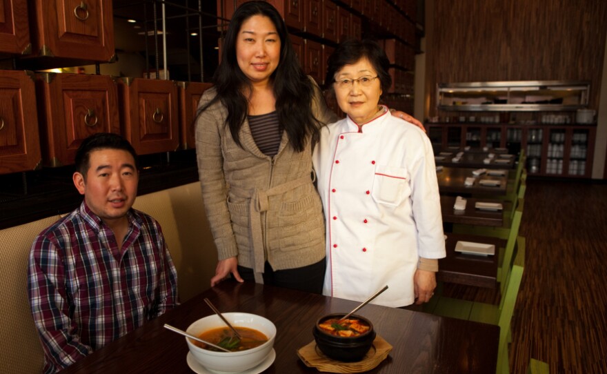 Danny Lee, Jean Lee and their mother, Yesoon Lee, cook home-style Korean soups at their Mandu restaurants in Washington, D.C.