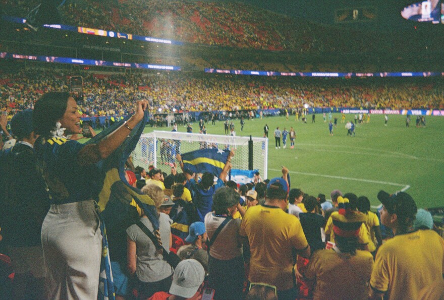 As shot on a Vivitar 35mm film camera, Curaçao fans cheer on their team at a World Cup game against Ecuador on June 20, 2026, at Arrowhead Stadium in Kansas City.