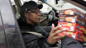 Stouffer's handed out free meals to federal workers in Solon, Oh., Wednesday, Jan. 16. Gayle Bell works at the Department of Treasury and has gone without pay for weeks. 