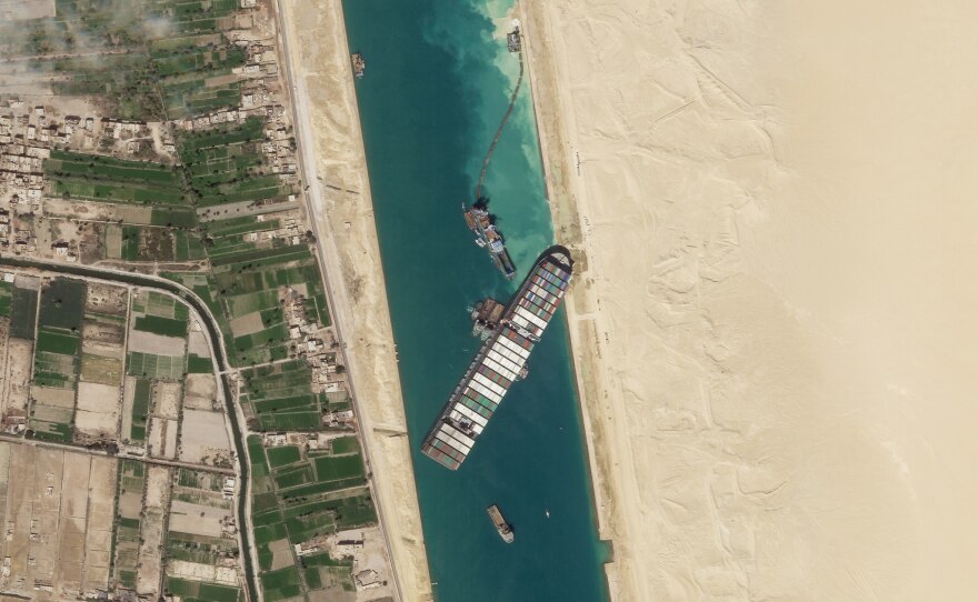 A satellite image shows the container ship Ever Given stuck in the Suez Canal near Suez, Egypt. Attempts to free the mammoth vessel stuck in Egypt's Suez Canal paid off on Monday.