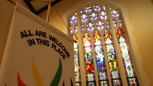 A banner welcomes all inside First United Methodist Church in uptown Charlotte.