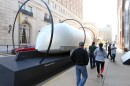 Curious onlookers get a closer look at Hyperloop One as it sits on display on a downtown city street in St. Louis on Tuesday, October 8, 2019.