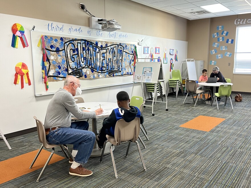 Volunteers with HOPE Tutoring work with students at McNutt Elementary School in Arlington Jan. 18, 2022. The tutoring group, which has provided free sessions to low-income students for 25 years, is piloting an in-school tutoring program.