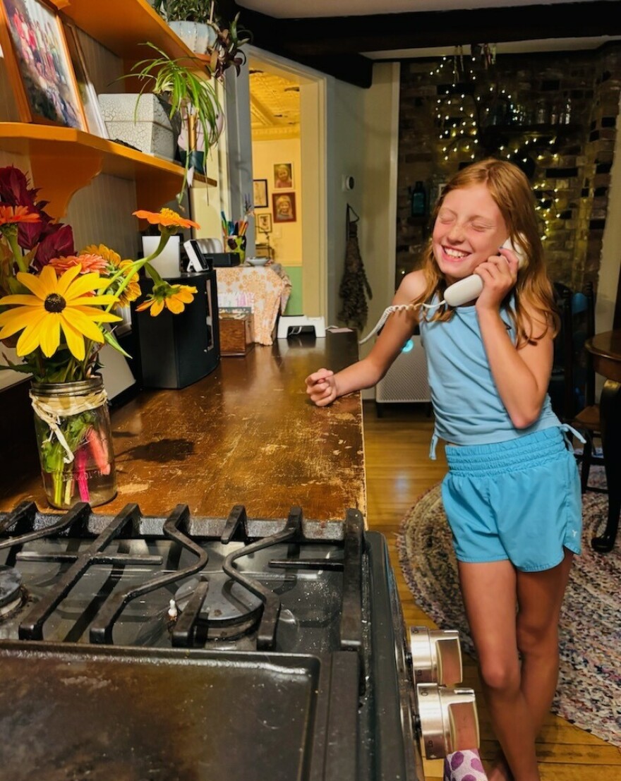 Molly Morse talks on the phone to a friend.