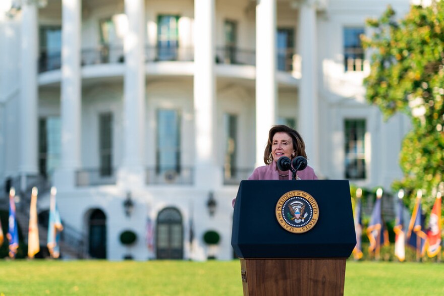 Nancy Pelosi on the south lawn of the White House in November 2021, before President Biden signed the Infrastructure Investment and Jobs Act.