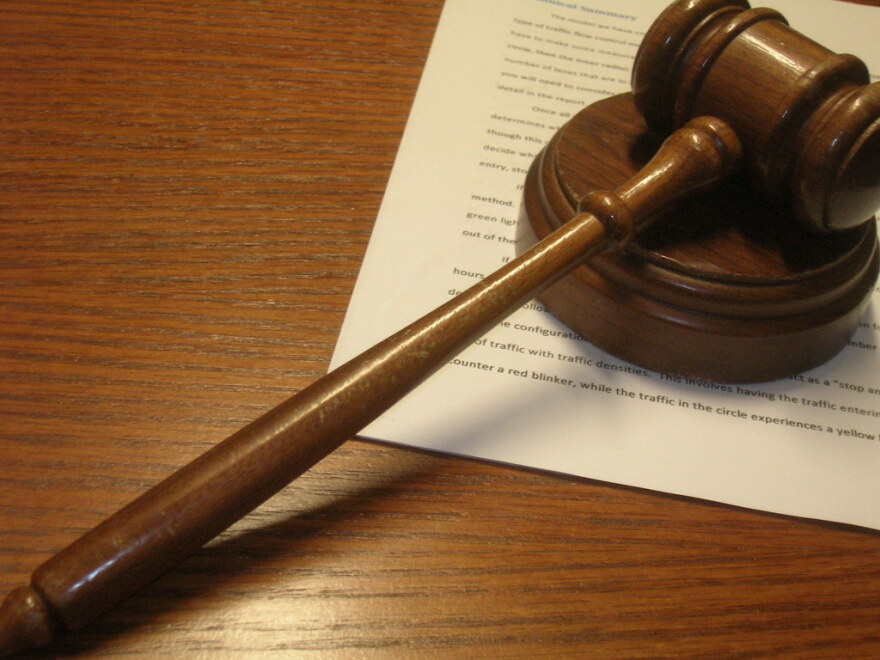  a gavel on top of a stack of papers
