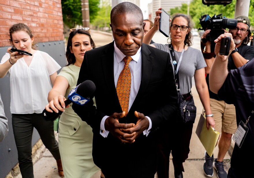 Lewis Reed, St. Louis Board of Aldermen President, refuses to answer questions by reporters regarding federal corruption charges being filed against Reed and two colleagues on Thursday, June 2, 2022, outside of the Thomas F. Eagleton U.S. Courthouse in downtown St. Louis. Reed was later sentenced to nearly four years in federal jail related to the scheme.
