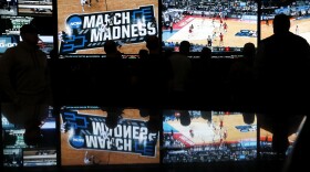 People watch coverage of the NCAA college basketball tournament at the Westgate SuperBook on March 15 in Las Vegas. Several states are expected to allow sports gaming after Monday's Supreme Court ruling.