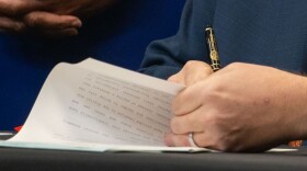 Gov. JB Pritzker signs a bill into law.